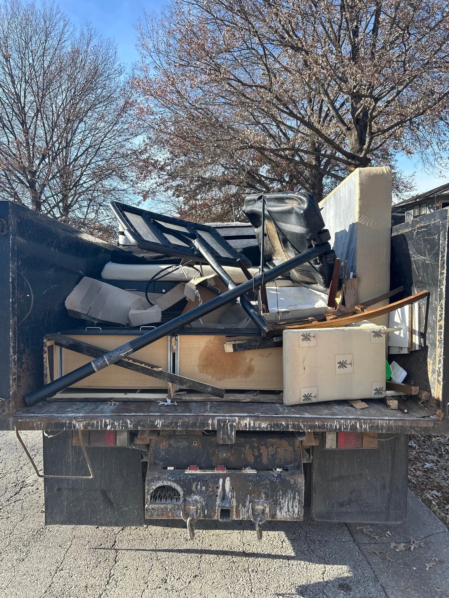 Bulk items loaded into a dump truck.