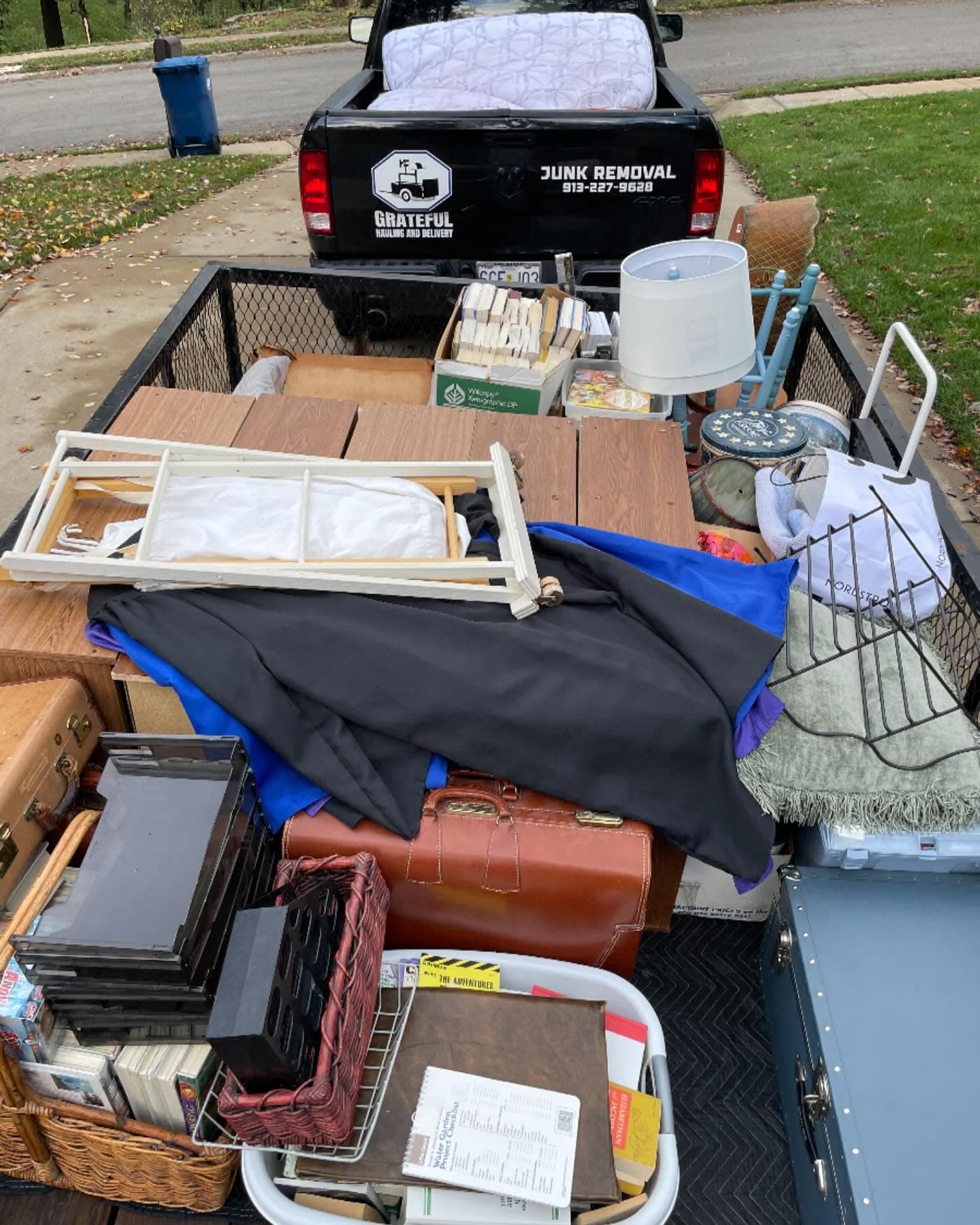 Household bulk items loaded on a trailer.