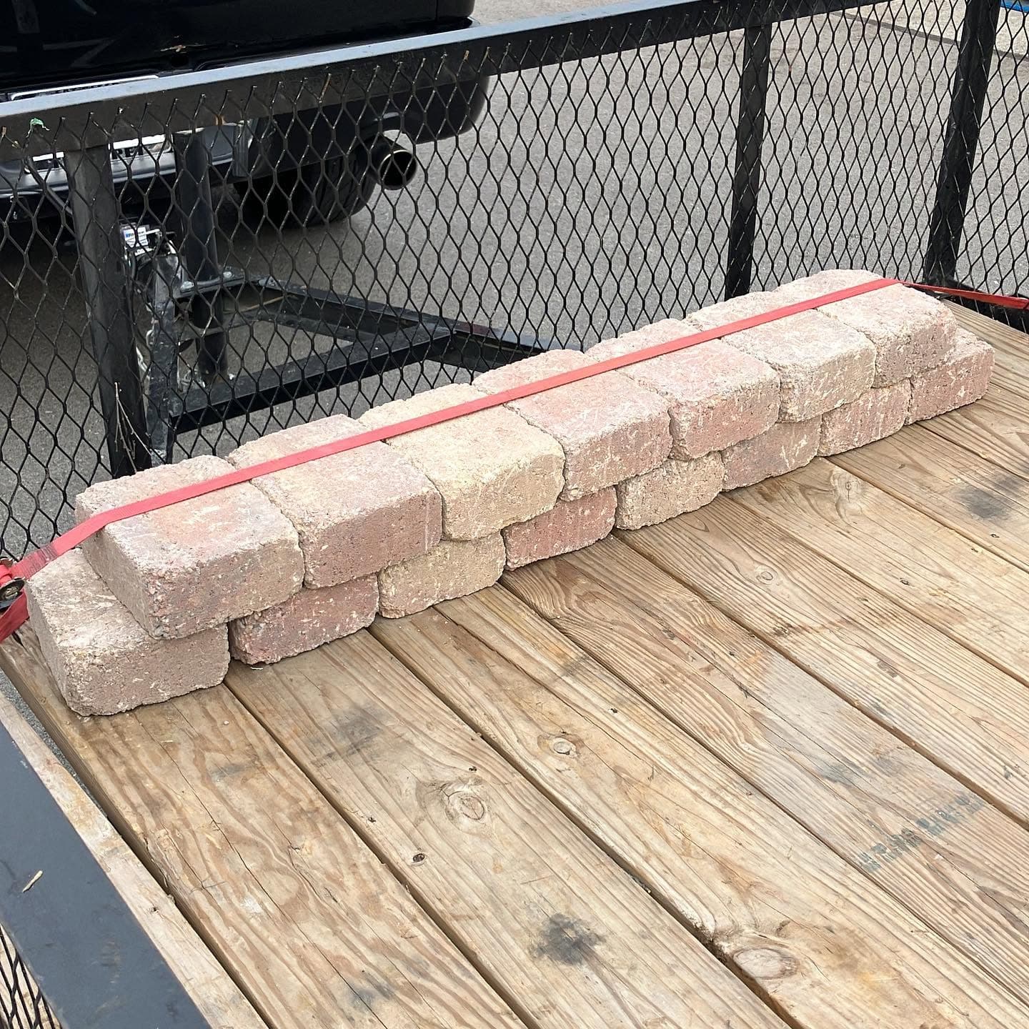 Landscape blocks strapped on a trailer.