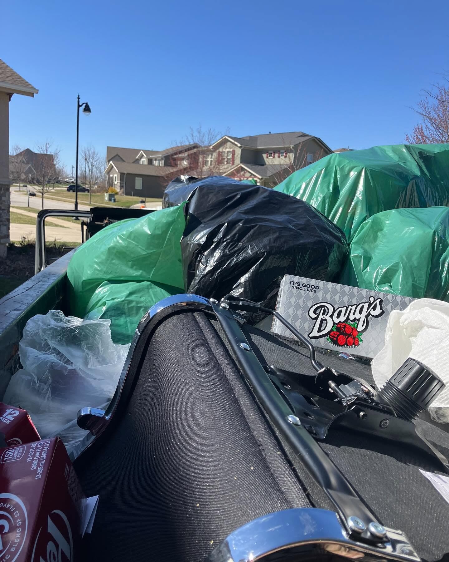 Trailer loaded with bagged cleanout debris at an apartment community.