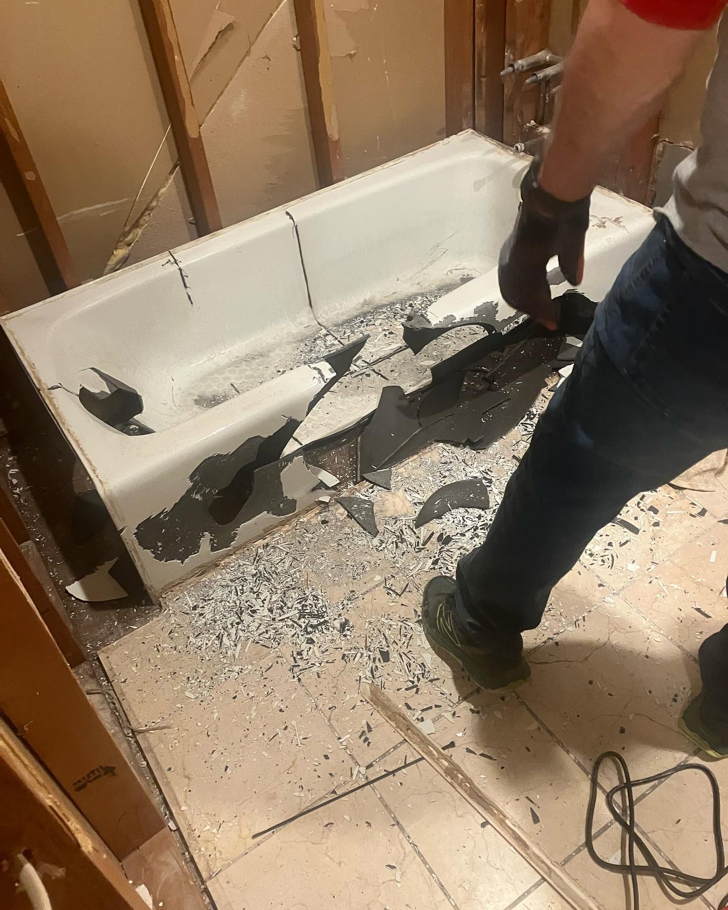 Bathroom demolition debris during a construction cleanup